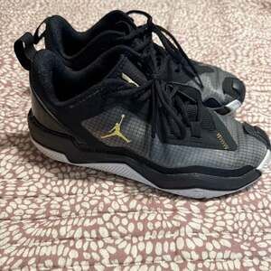 Jordan Black Sneakers with Gold Details